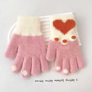 Cute pink knit gloves detail view featuring sweet heart and lovely cat paw patterns for kids.