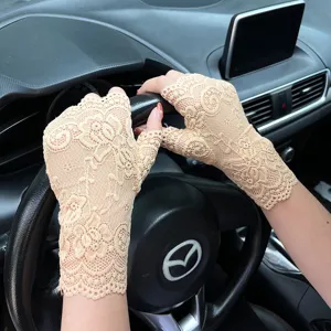 Delicate floral lace fingerless gloves detail view, perfect summer sun protection driving accessory.