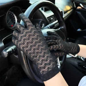 Detailed close-up of women's black floral lace driving gloves for summer sun protection.