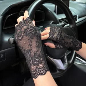 Black floral lace fingerless gloves detail shot showing delicate fabric and chic design.