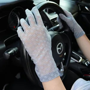 Close-up detail of women summer lace driving gloves, breathable sun protection design.