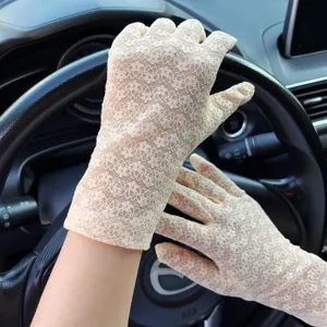 Elegant beige floral lace gloves for women, ideal for driving, sun protection, and outdoor use.