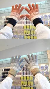 Close-up shot of winter knitted gloves with thick plush lining and colorful pattern details.