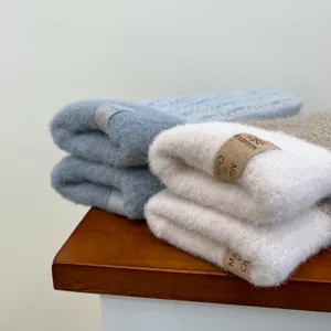 Plush fleece warm mittens winter thick cozy gloves detail shot soft texture solid color