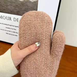 Detailed view of women's winter brown fleece warm mittens, cozy thickened texture design.