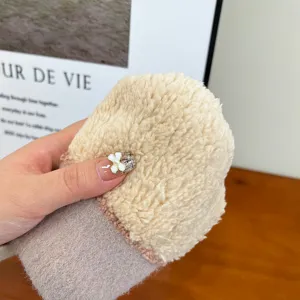 Close-up shot of women winter thick cozy fleece warm mittens detail view soft texture