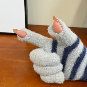 Detail view of cozy striped knitted fingerless gloves showing soft texture and fingertip exposure.