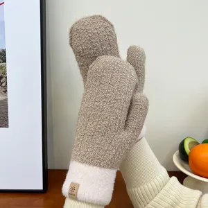 Detailed view of winter plush thick warm mittens in khaki with cozy fleece cuffs.