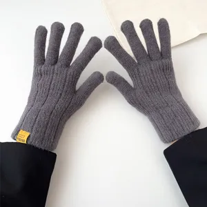 Grey knit gloves detail showing ribbed texture and cuff label for winter warmth and daily wear.