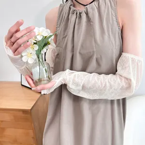 Detail shot of women floral lace sun protection sleeves, sheer fabric for summer outdoor.
