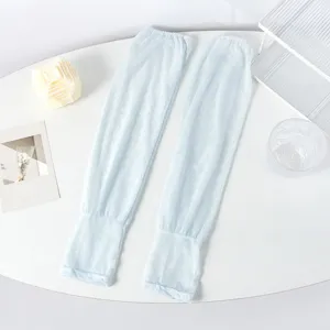 Detailed view of light blue lace sun sleeves, featuring breathable mesh and floral prints.