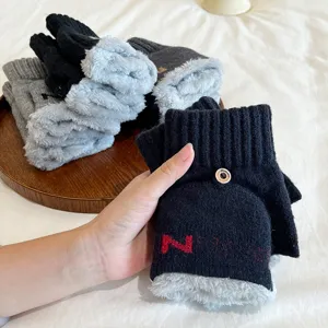 Detailed view of winter knitted convertible gloves with plush fleece lining and cozy half-finger design.