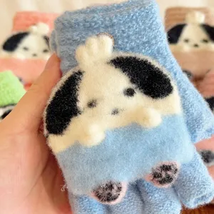 Close-up detail of cute cartoon puppy knit half-finger winter warm gloves texture.