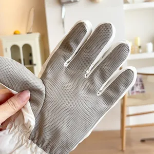 Close-up detail shot of winter ski gloves with anti-slip grip palm and warm lining.