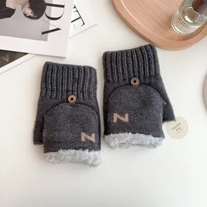 Knitted half-finger convertible winter gloves with plush trim and wooden button closure.