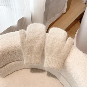 Cozy women fuzzy winter mittens in warm beige, thick knit thermal gloves for cold weather.