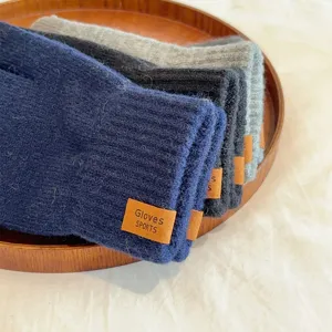Detailed view of men's solid color knit warm gloves, winter thermal cycling full-finger gloves.