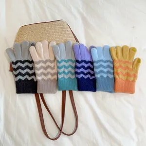 Detailed view of colorful knitted touchscreen gloves with wavy striped pattern, warm winter style.