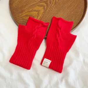 Red knit fingerless gloves with cable pattern for women, stylish autumn winter warm accessory.