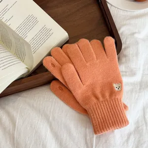 Orange knitted touchscreen gloves with cute bear embroidery, warm winter cozy fashion mittens.