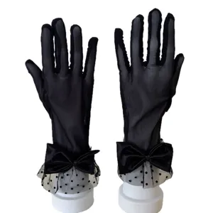 Black mesh polka dot lace gloves with bow for women, stylish summer sun protection accessories.