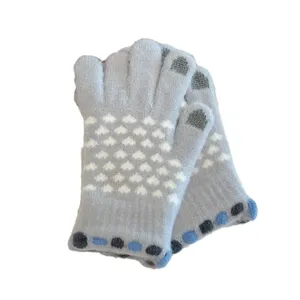 Women cute knit winter warm touch screen gloves with heart pattern and anti-slip cuff features.