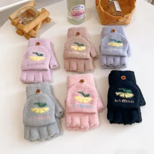 Details of knitted half-finger flip-top gloves featuring cute lemon pattern and cozy fabric.