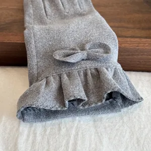 Grey women winter thermal gloves with cute bow and lace hem, soft Dralon fabric for cold weather.