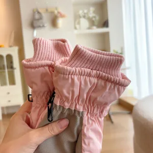 Pink windproof ski gloves detail view, fleece thickened warm winter outdoor sports gloves.