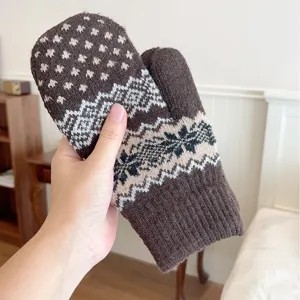 Brown knit snowflake mittens detail closeup, thick warm winter thermal windproof gloves for couples.
