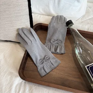 Detailed view of women's autumn winter thermal velvet gloves with cute bow and ruffle design.