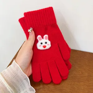 Red knitted winter gloves featuring a cute white bunny motif for warm and cozy daily wear details.