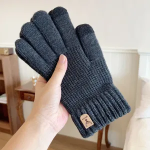 Men's dark gray knitted touchscreen thermal gloves with deer logo detail for outdoor winter.