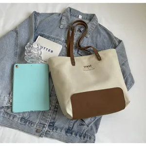 Canvas tote bag for women, large capacity shoulder bag, casual commuting handbag for daily use and school.