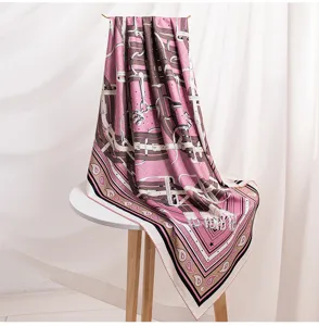 Luxurious pink silk wool square scarf with classic equestrian belt print for women.