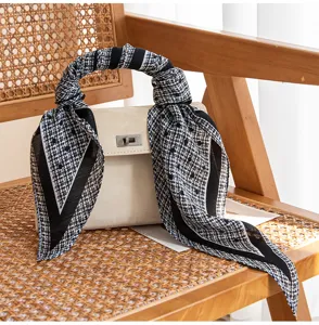 Black and white patterned long silk scarf, elegant accessory for women's shirts and bags.