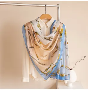 Elegant women's silk scarf featuring a classic equestrian belt and chain print design.