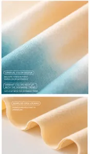 Close-up details of soft imitation cashmere scarf with gradient design and seamless edge.