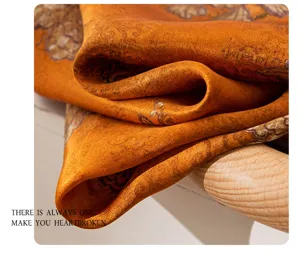 Luxury orange silk scarf featuring elegant vintage floral print, perfect women neckerchief.