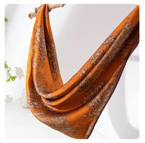 Elegant orange silk scarf with luxury floral print, breathable decorative neckerchief.