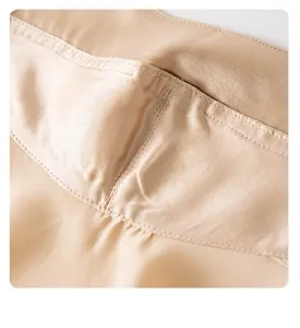 Detailed close-up of premium silk sun protection mask showing fine stitching texture.
