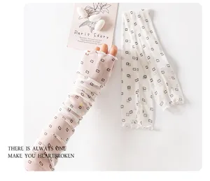 Lightweight mesh sun protection sleeves with square print for summer outdoor wear detail.