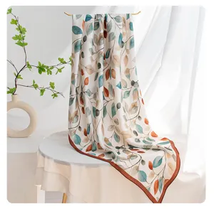 Double-sided botanical print silk scarf for women, elegant floral neck wrap detail view.