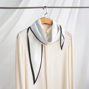 Women's silk double crepe scarf with chic black border and stripe print for autumn wear.