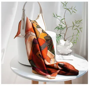 Detail shot of silk-wool square scarf with artistic guitar print, elegant winter shawl texture.
