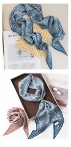 Detailed view of elegant silk skinny scarf with classic paisley and butterfly print patterns.