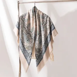 Elegant women's silk wool scarf featuring a vintage paisley print and stylish fringe edges.