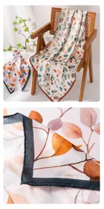 Detailed view of women's silk scarf with botanical leaf print, featuring exquisite hem craftsmanship.