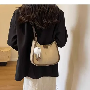 Classic khaki underarm shoulder bag with brown trim and cute plush charm for autumn daily style.