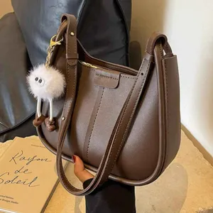 Chic brown leather underarm bag for women, stylish autumn winter single shoulder handbag.